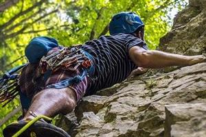 Man climbing rock face